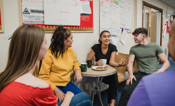 Image of teenage children in an informal workshop