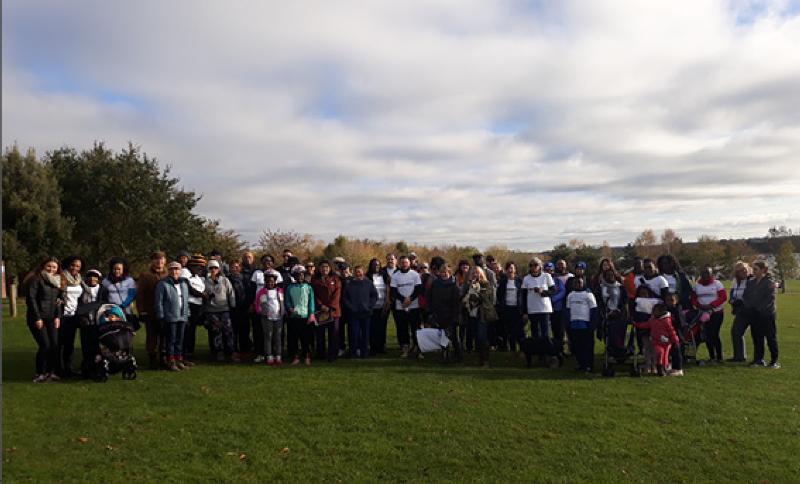 Group picture of staff and their families who took part in the walk for Windrush on 27 October. 