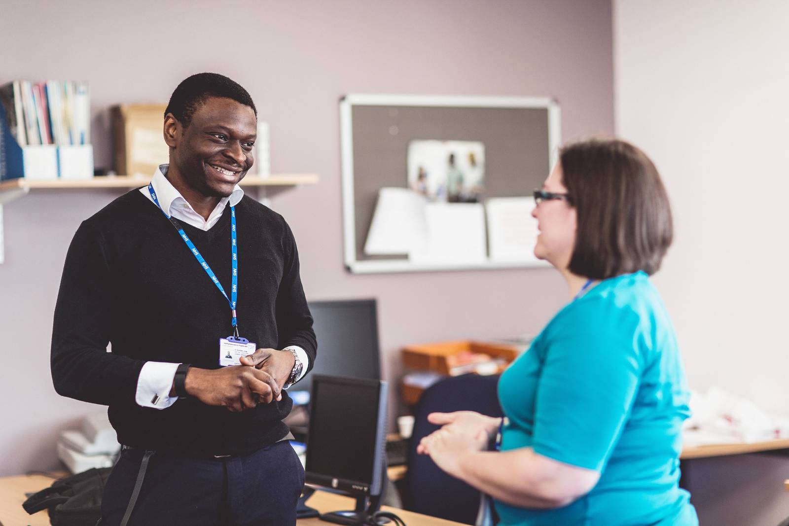 Two members of staff having a conversation