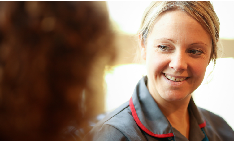 nurse talking to a person