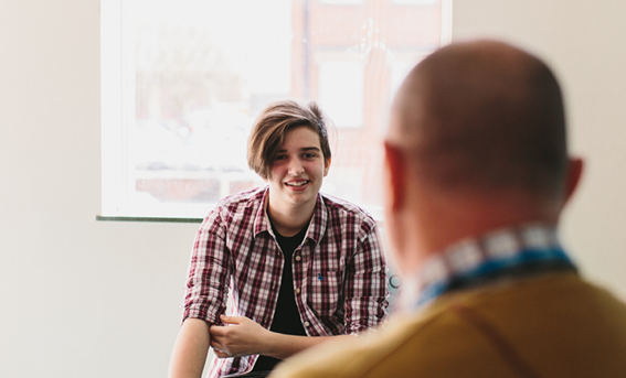 Teenage service user talking to professional