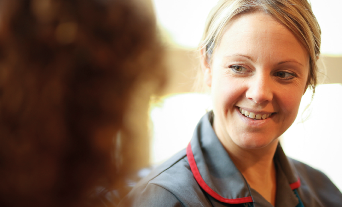 Female colleague smiling at client