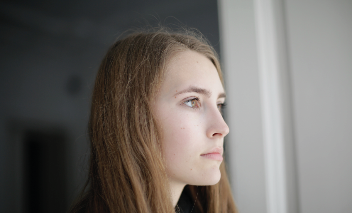 Young women looking out of window