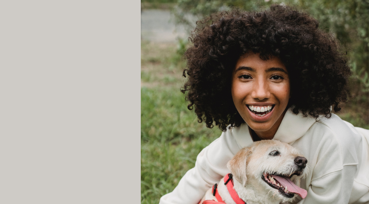 Young women stroking dog
