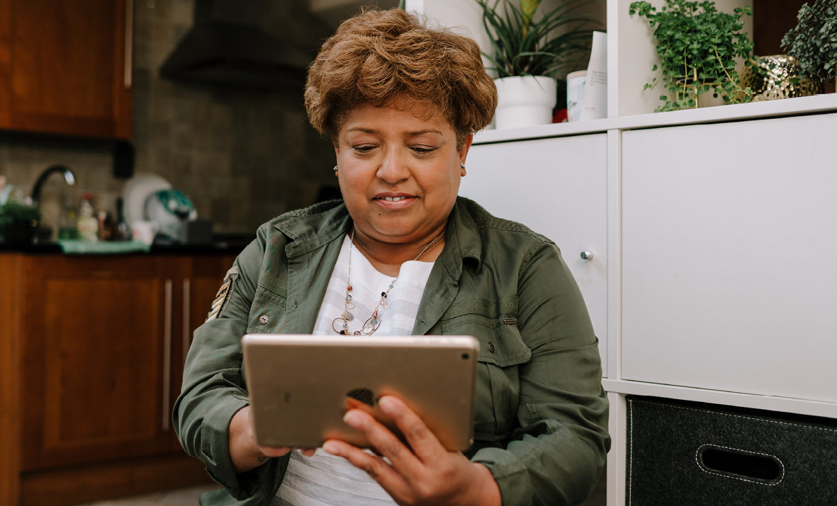 lady looking at handheld tablet device