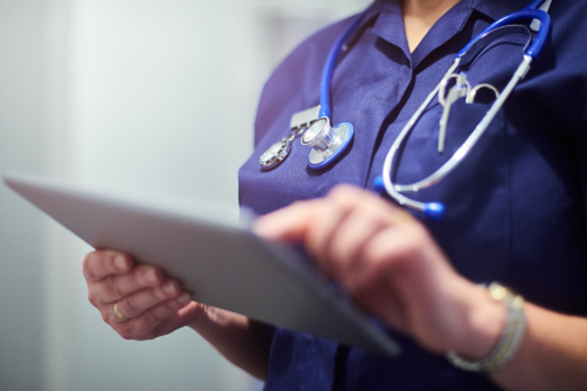 Hospital nurse holding an iPad