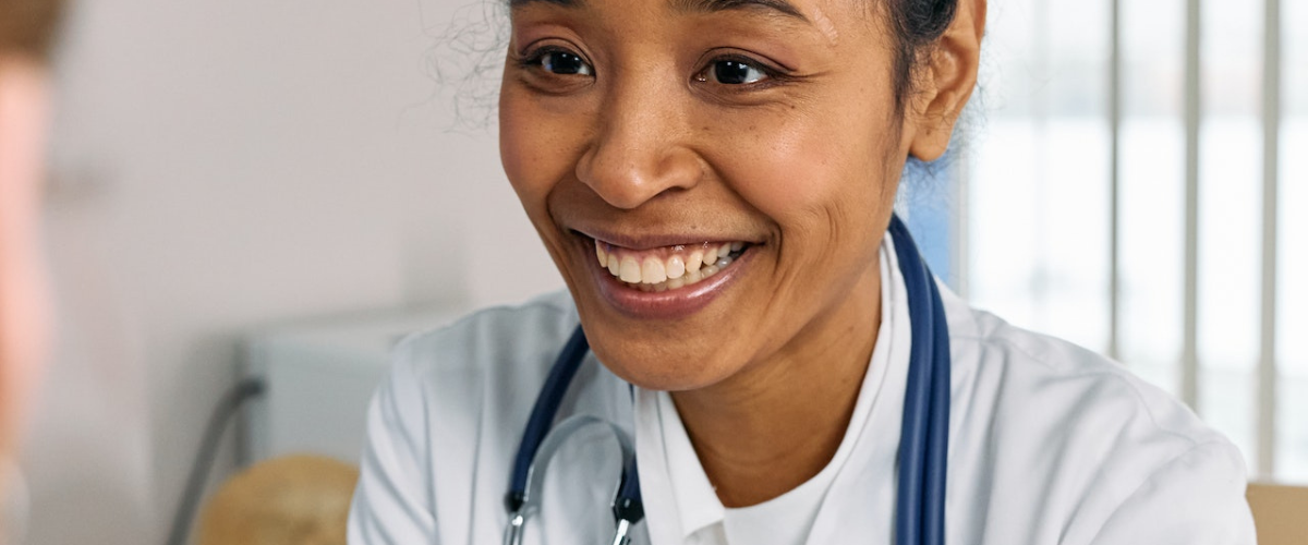 Doctor smiling at patient