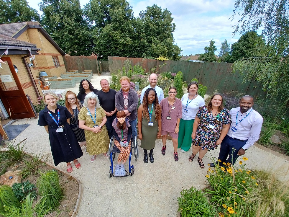 Guests at sensory garden opening at The Warren