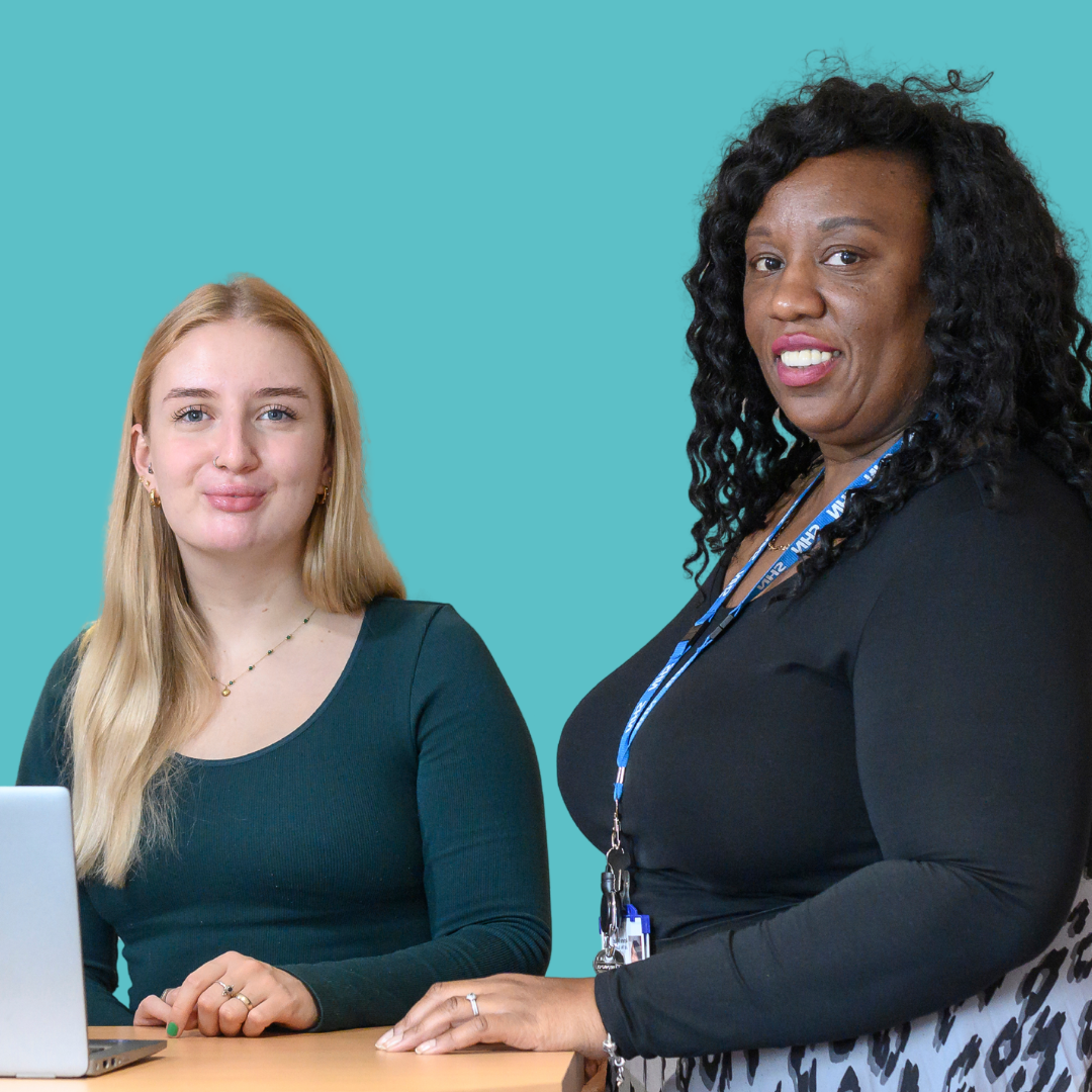 Two smiling members of team NHFT