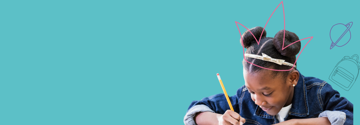 Child sat at desk in a classroom