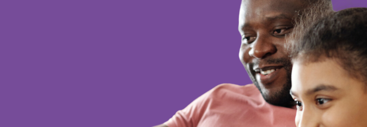 A photograph of a smiling father with a young girl against a purple background