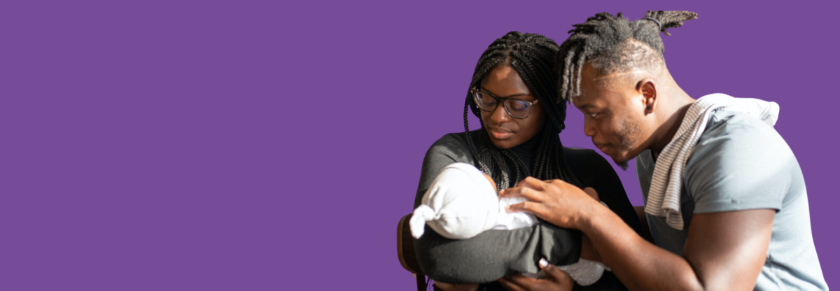 A young mother and father cradling a newborn baby against a purple background