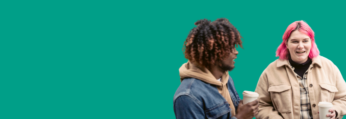 A man and woman having a coffee and talking against a green background
