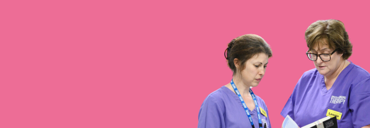 A cutout image of two female speech and language therapy professionals in conversation against a pink background