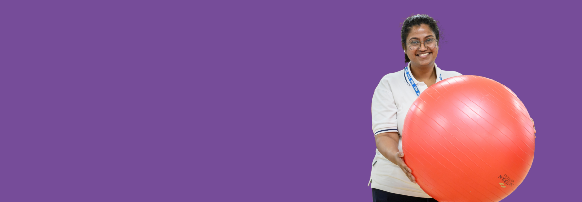 A cutout image of an NHFT physiotherapist holding a gym ball against a purple background