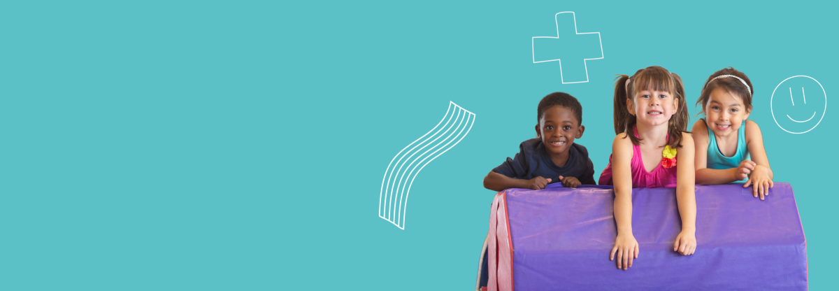 A cutout image of three young children using soft play equipment against a teal background