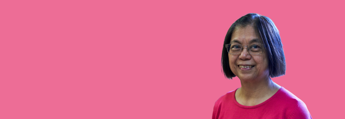 A cutout image of an older woman smiling against a pink background