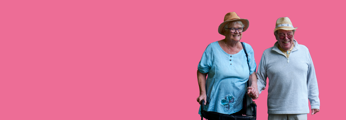 A cutout image of an older man and woman smiling together against a pink background