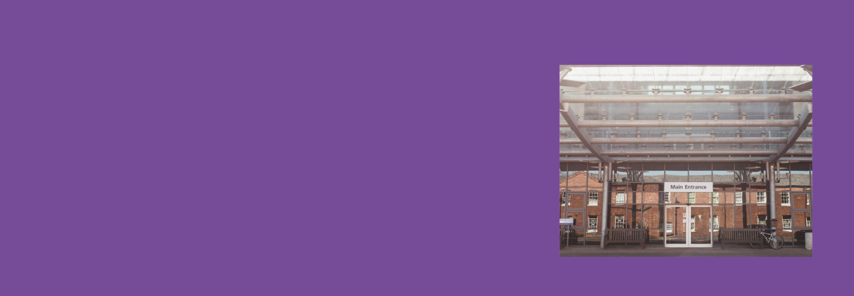A photograph of the main entrance to Danetre Hospital against a purple background