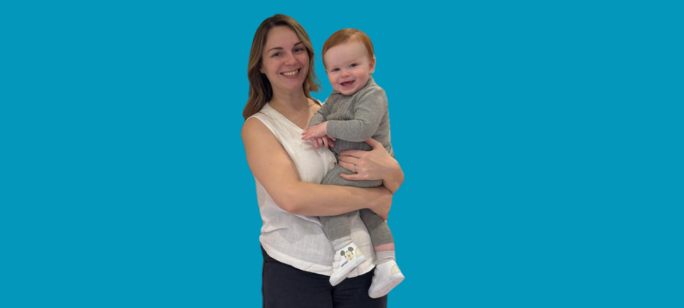 A cutout photograph of Shannon Goff smiling and holding baby Ronnie in her arms