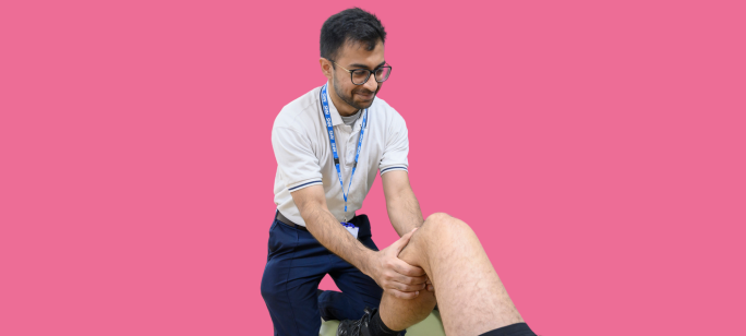 A cutout photograph of a male NHFT physiotherapist performing therapy on a person's leg