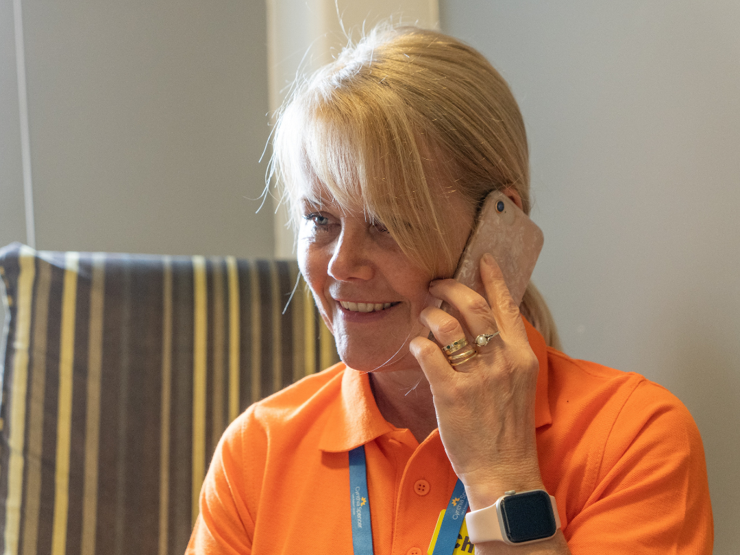 Lady on the phone volunteering
