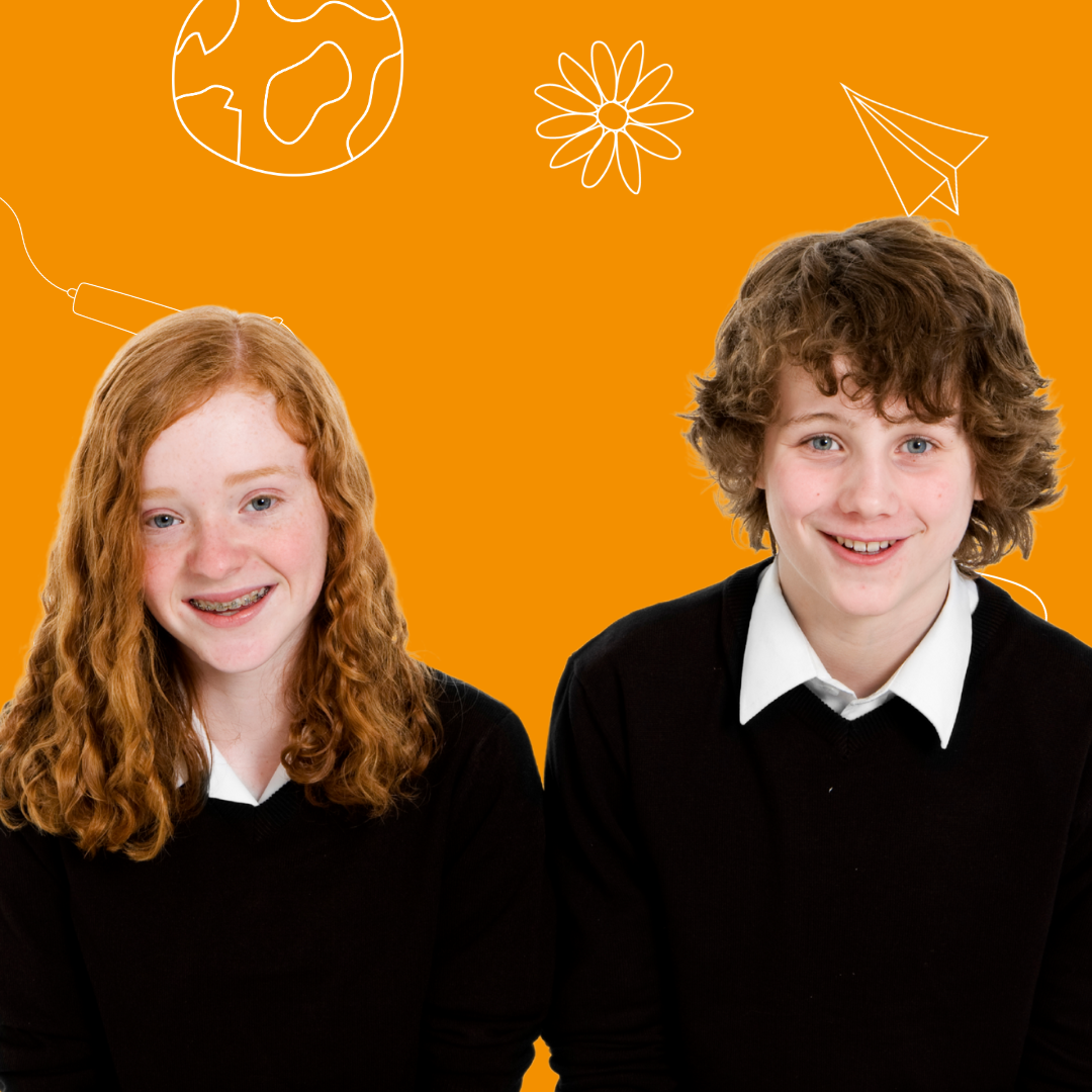 Two pre-teens smiling against an orange background with doodles