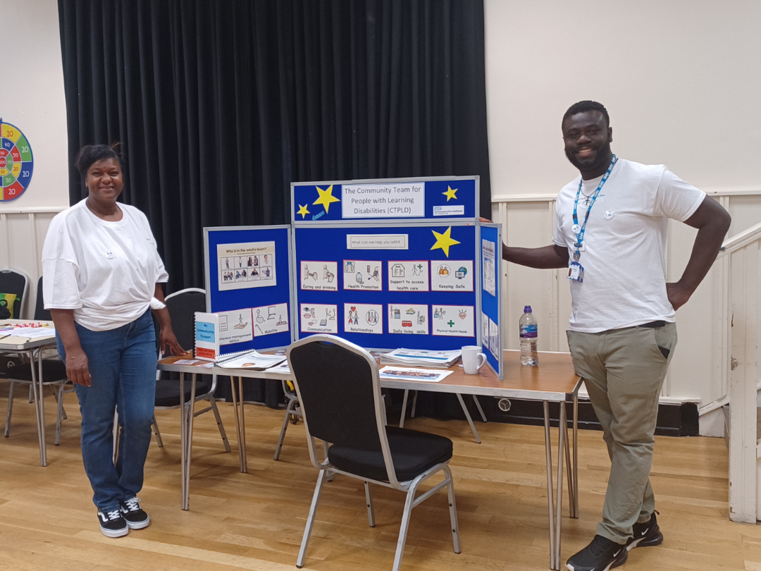 Two members of staff at an event at KGH - LD service